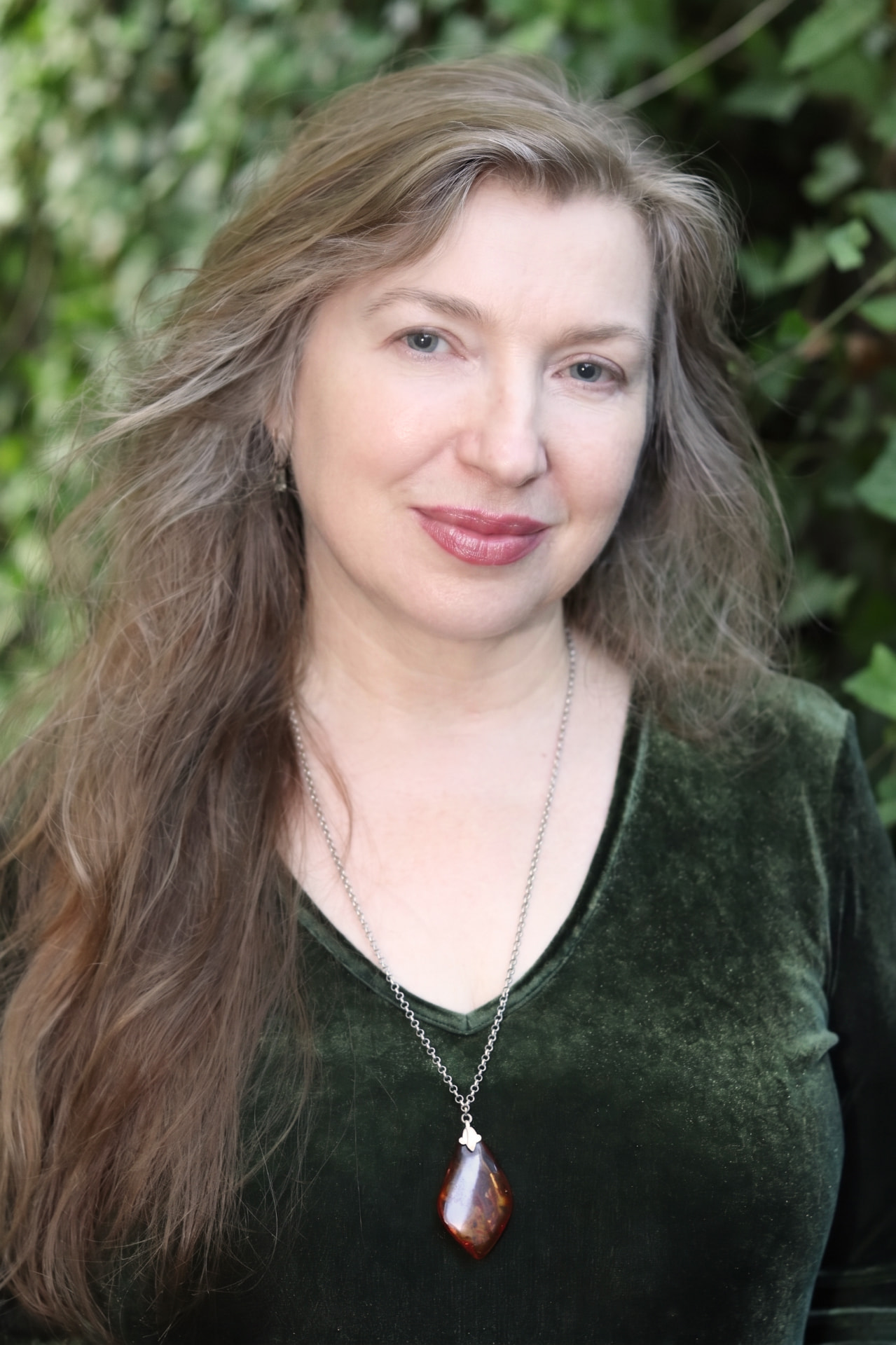 Moya O'Dwyer outdoors in a deep green velvet top