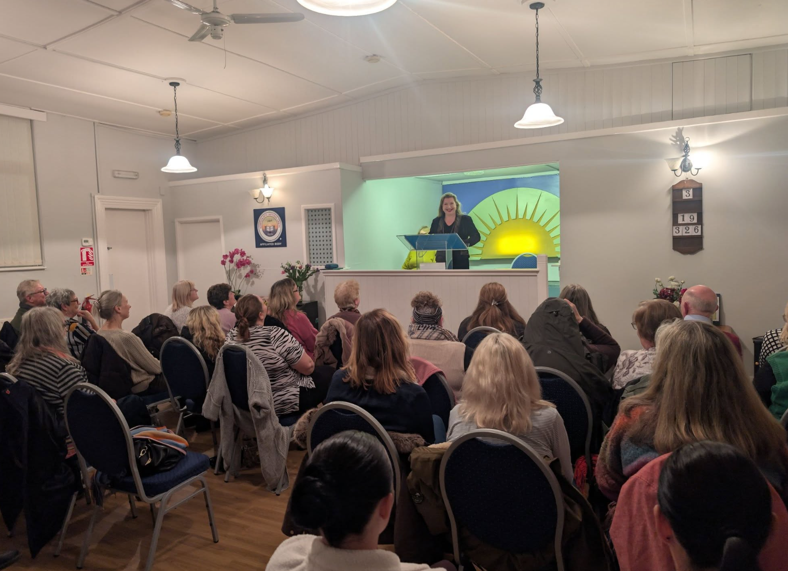 Moya O'Dwyer demonstrating mediumship to a full congregation at Bridgend Spiritualist Church